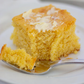 slice of cornbread slathered with butter