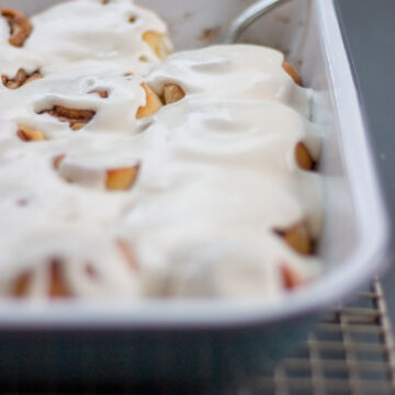 pan of cinnamon rolls with icing