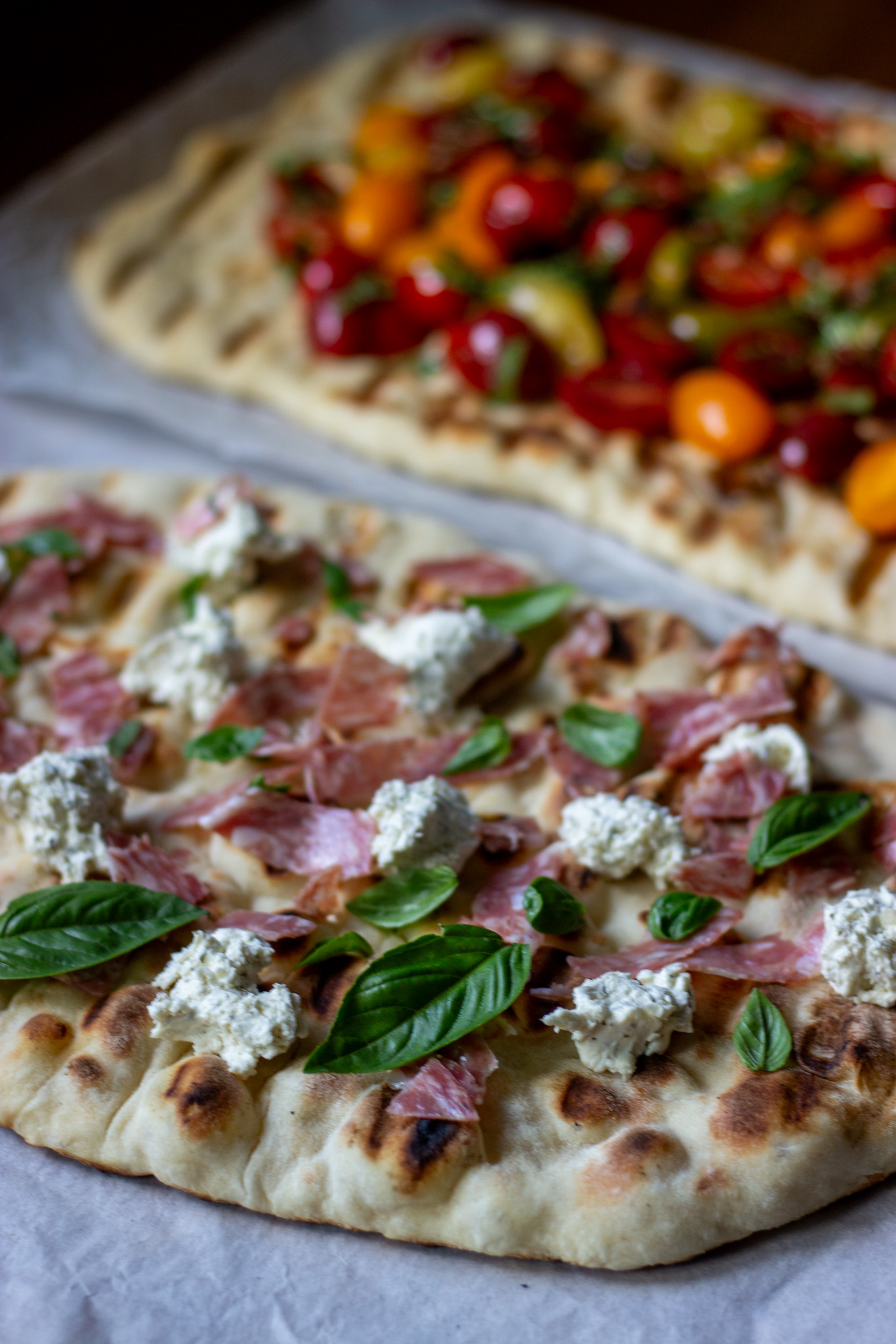 Two sourdough discard flatbreads with two varieties of toppings.