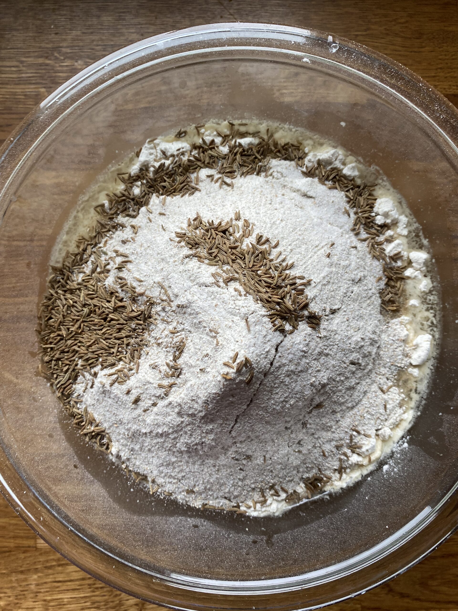 Dry ingredients added to mixing bowl with the wet ingredients.