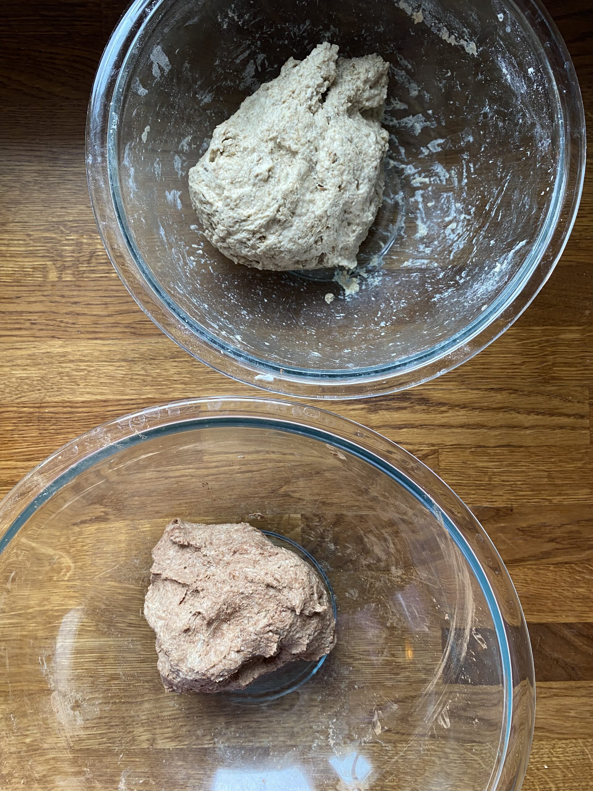 The light dough and the dark dough in separate bowls to rest before combining.